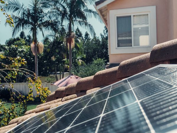 Solar engineer technician logging array tracking parameters via handheld panel tablet