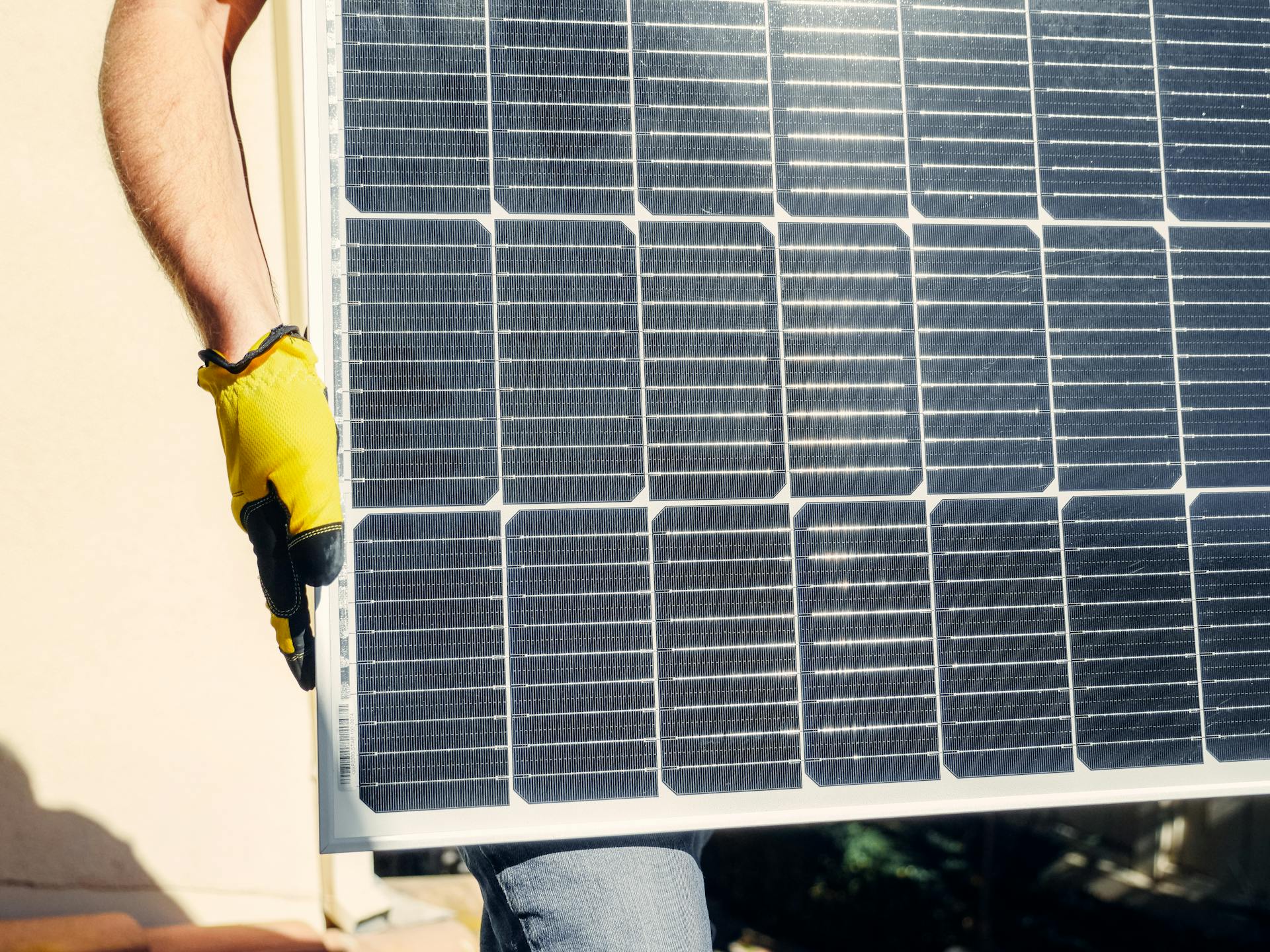 A Person Carrying a Solar Panel