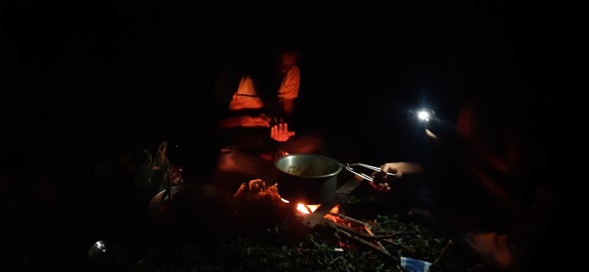 Engineers inspecting solar panels installed in the field