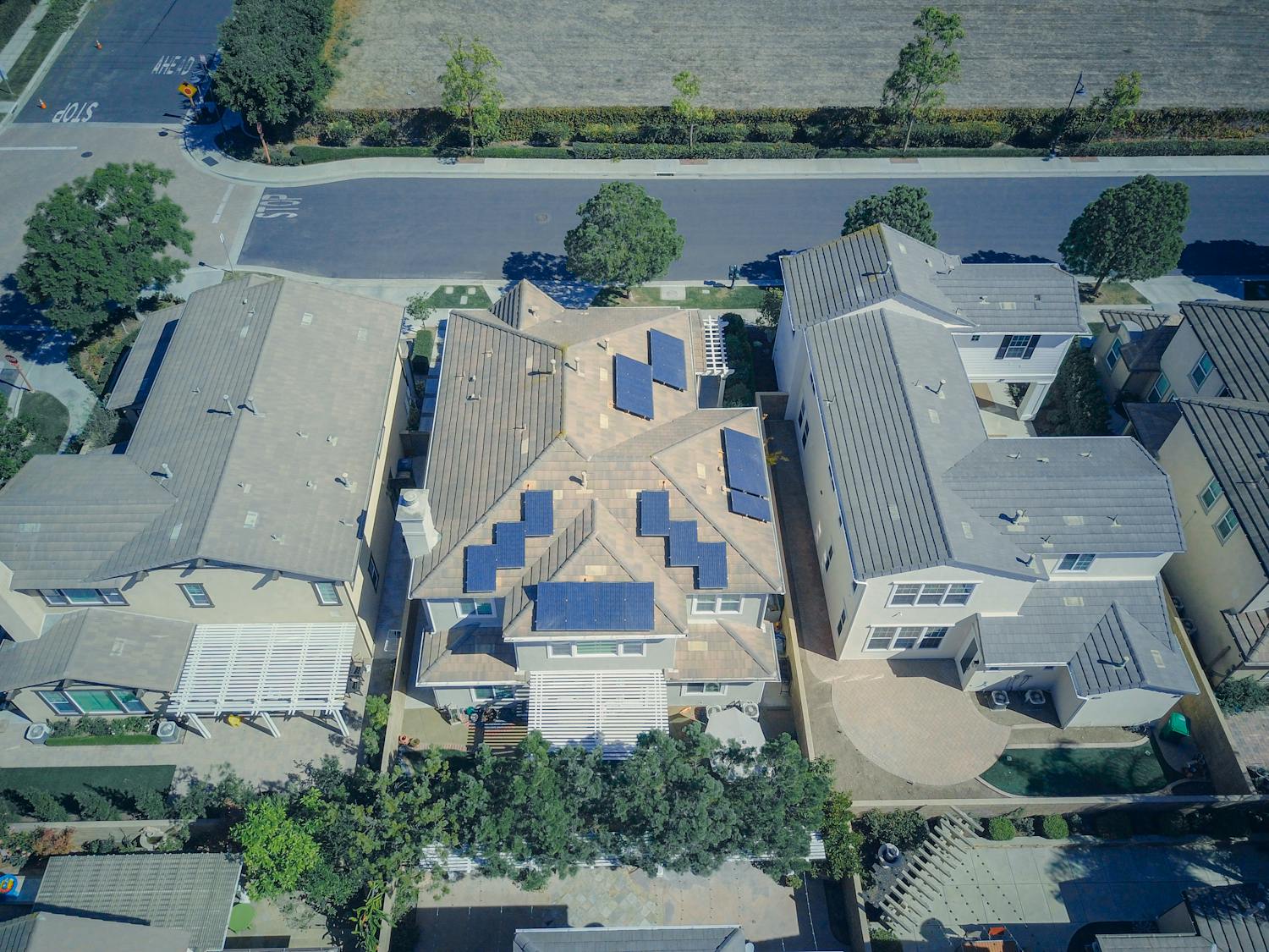 Aerial view of suburban homes with quality roofing