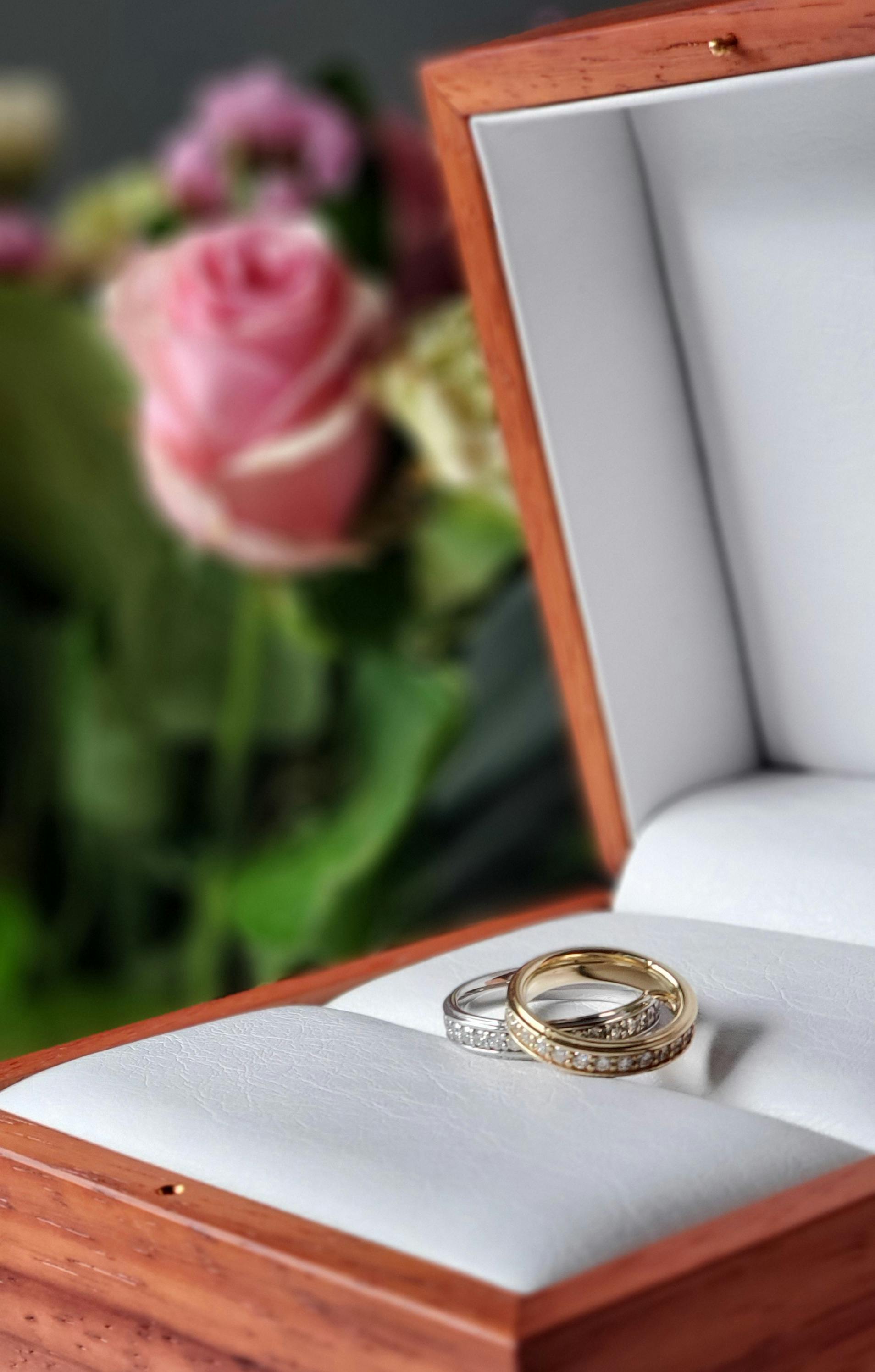 wedding rings in a wooden jewelry box