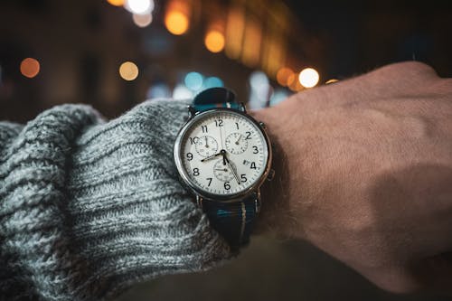 Free Person Wearing an Analog Chronograph Wrist Watch Stock Photo