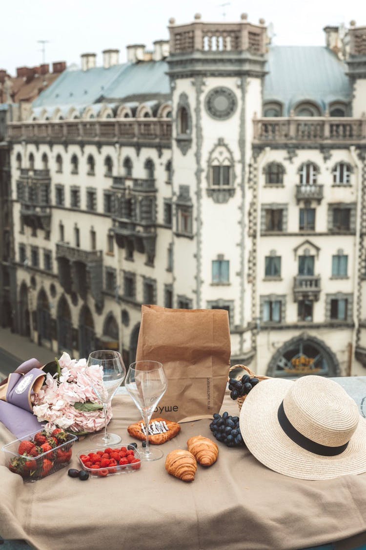 Aesthetic Picnic Set Up In Front Of An Old Building 