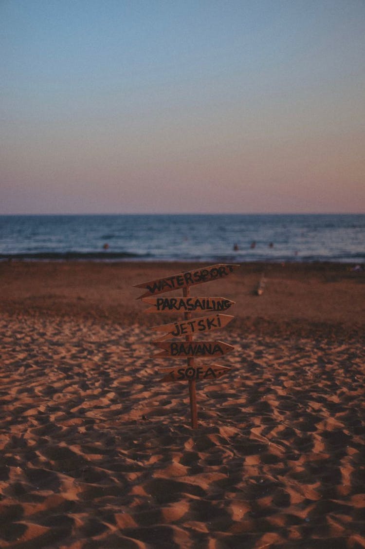 Directional Arrow In A Beach For Water Activities