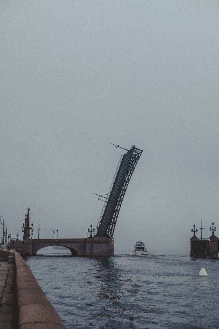 Boat Passing By Raised Vertical Bridge