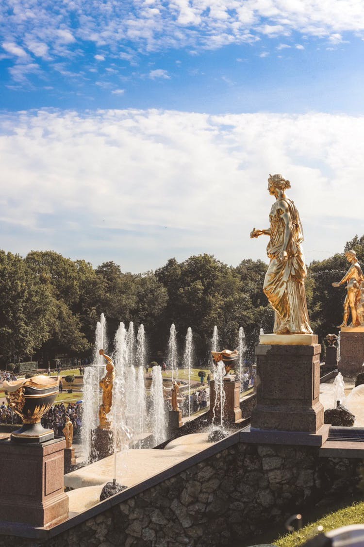 Golden Statues And Fountains In Garden