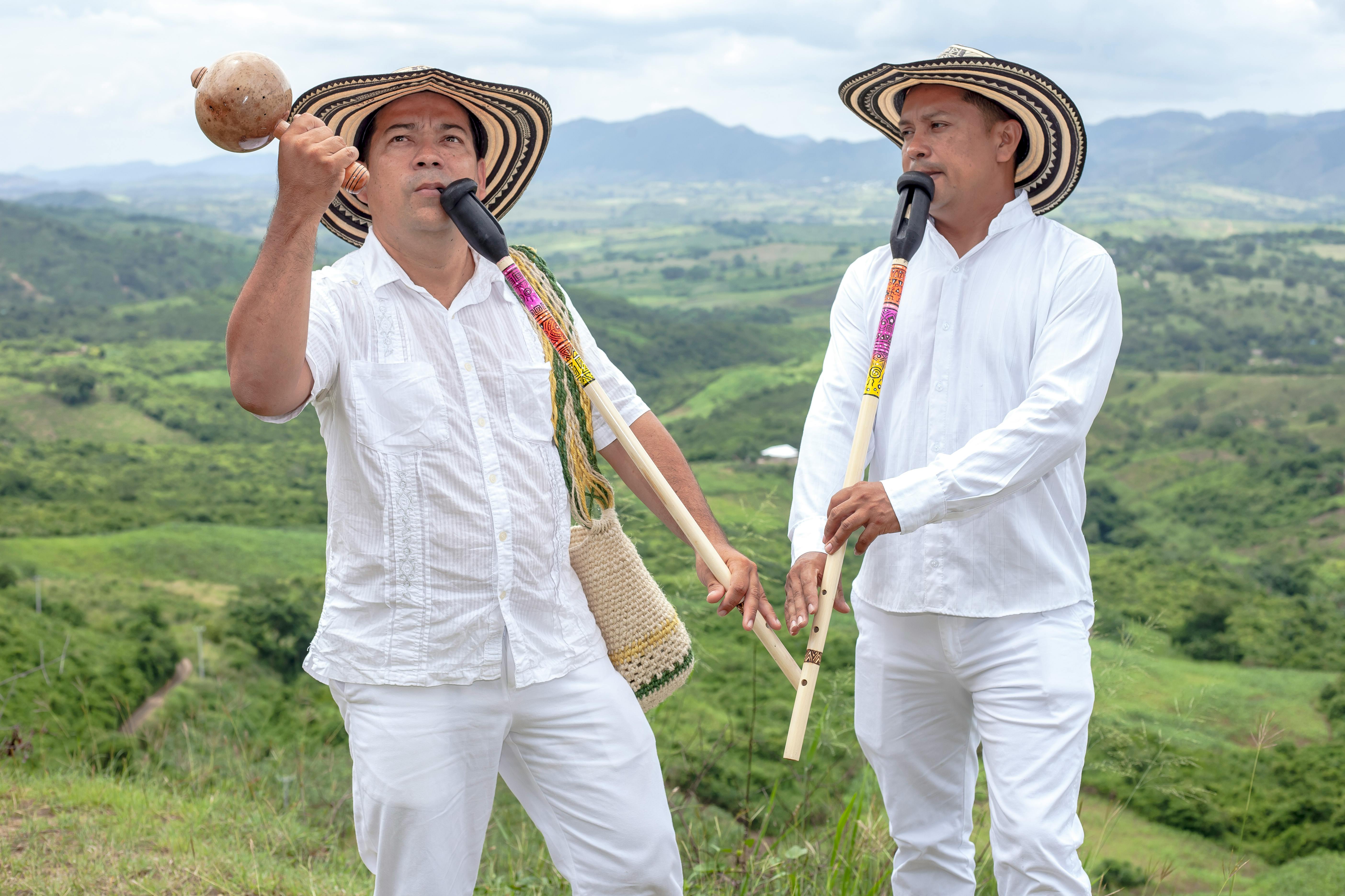 Colombian Musicians in White Shirt with Flutes in Hands