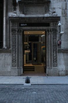 Captivating entrance of a historic bank building with ornate details and classic architecture.