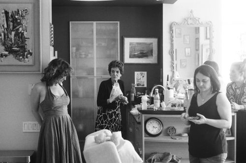 Free Women enjoying a relaxed moment in a cozy kitchen setting. Stock Photo