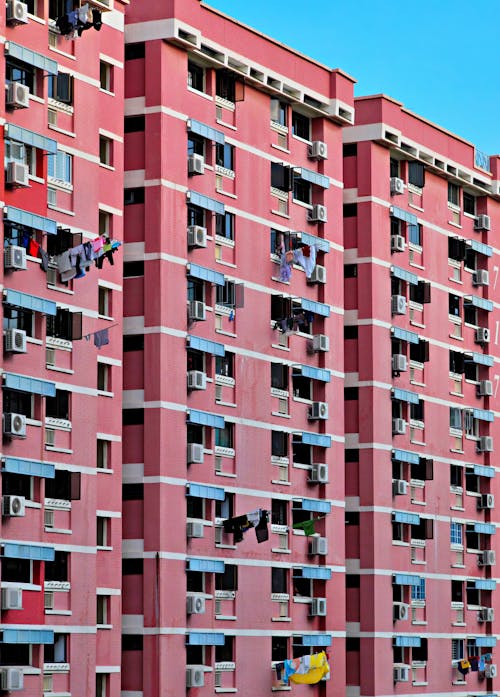 Facade of a Tall Block of Flats with Balconies 