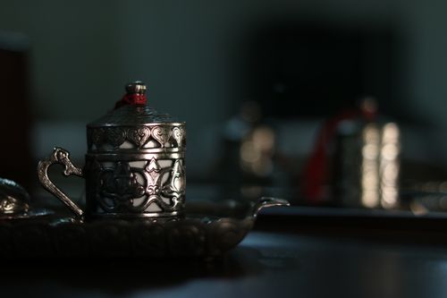 Free Close-up of an ornate silver tea set with decorative details and selective focus. Stock Photo