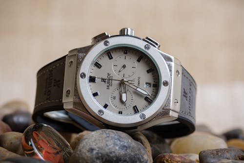 Free A Luxury Watch over Rocks Stock Photo