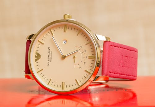 An Emporio Armani Wristwatch on Red Surface