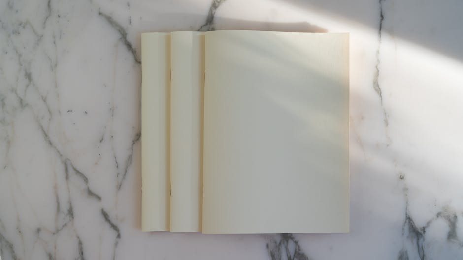 Clean, modern notebook with crisp white pages turning smoothly against a simple background - animated book flipping pages gif