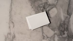 Stack of blank cards on marble, by Brando.ltd on Pexels