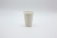 Paper Cup with Lid on White Surface