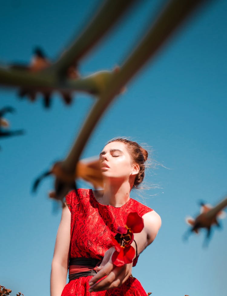 A Woman Throwing A Flower