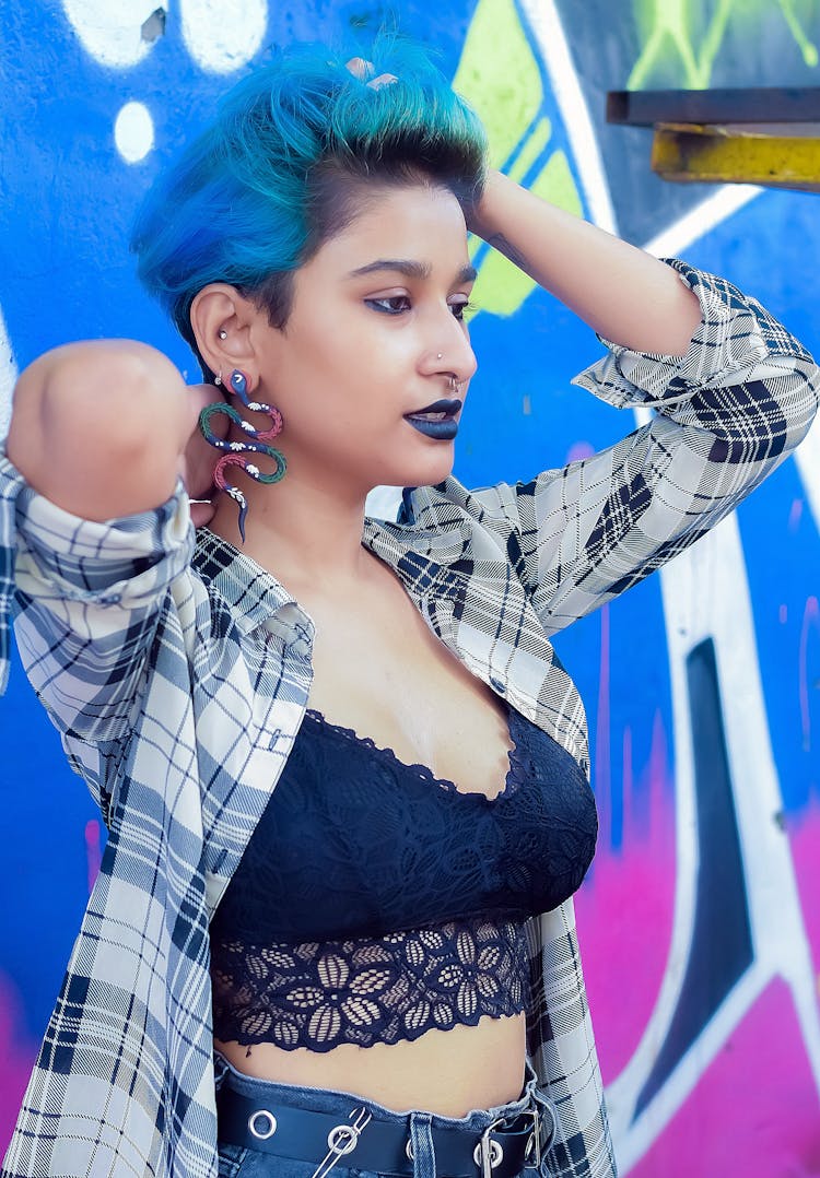 A Woman With Blue Hair And Blue Lipstick