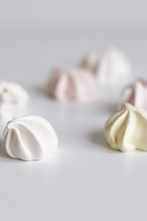 Pieces of Meringue on White Surfaces