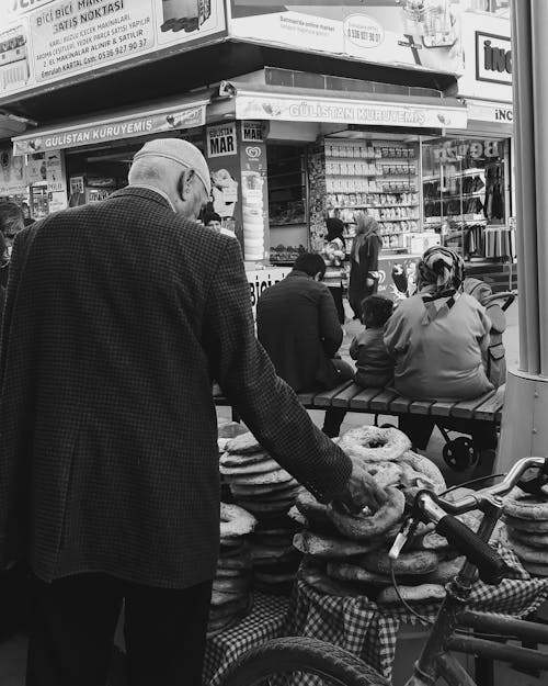 Free A Man Buying Bread in the Street Stock Photo