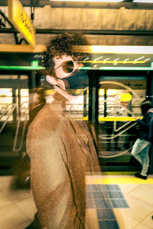 A Man Wearing Mask in a Subway