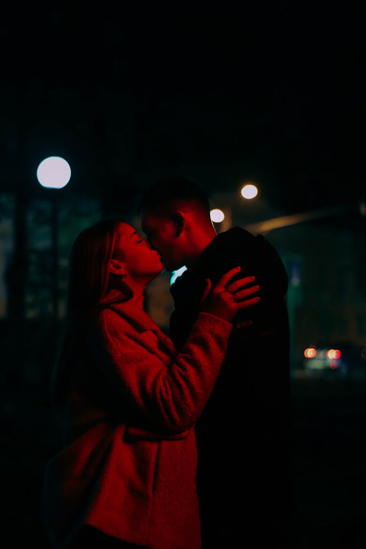 A Couple Kissing In The Dark