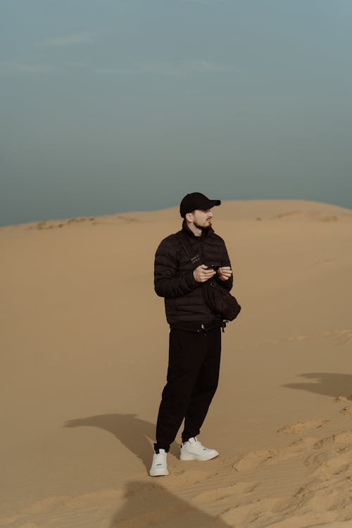 A Man Standing on Desert