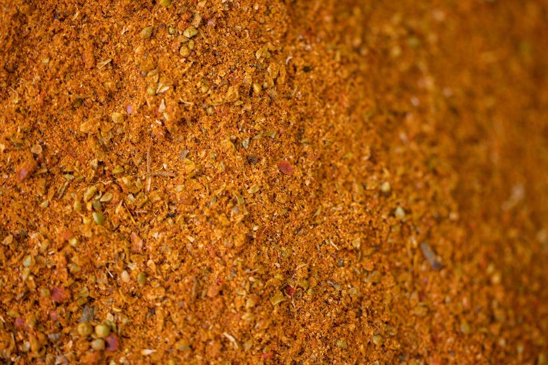 Close-up Photo of Brown Powder and Grains