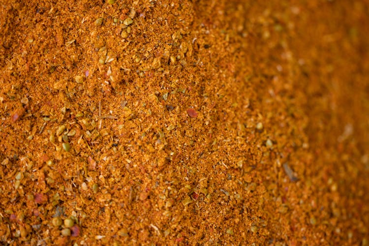 Close-up Photo Of Brown Powder And Grains