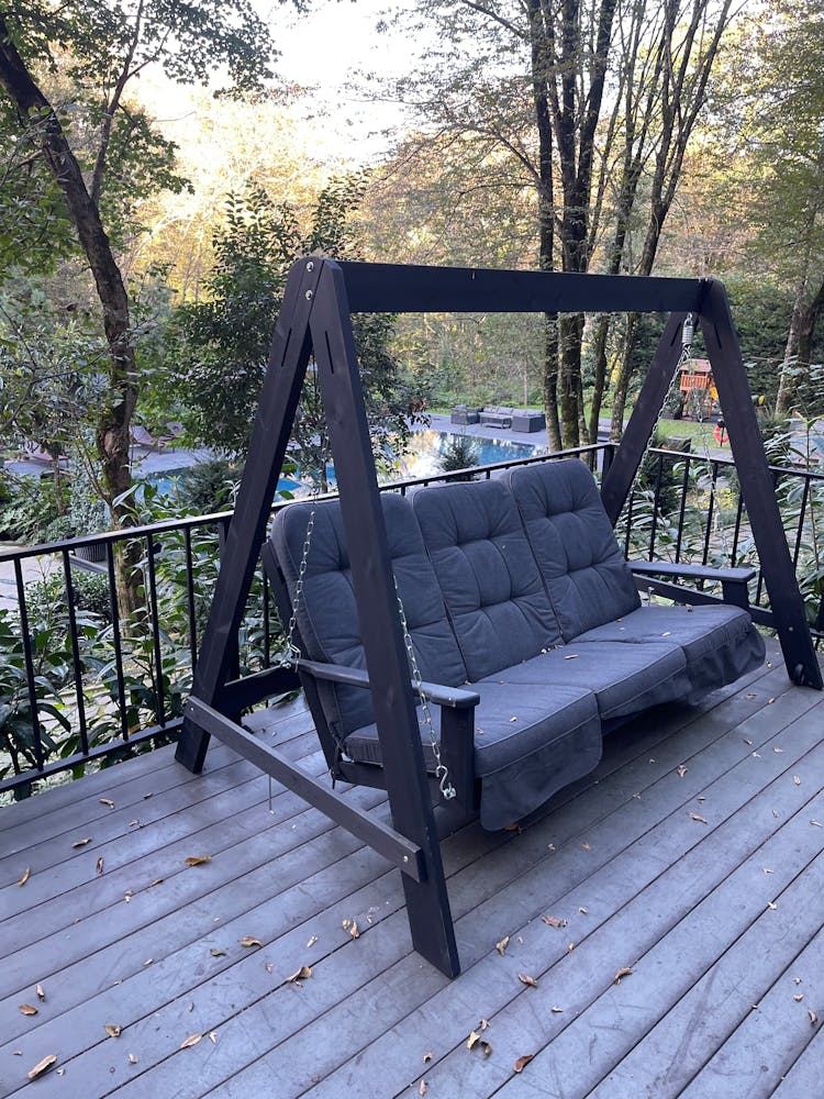 Cushion Sofa On A Swing Placed On A Porch 