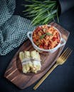 Red Sauce on Brown Wooden Chopping Board