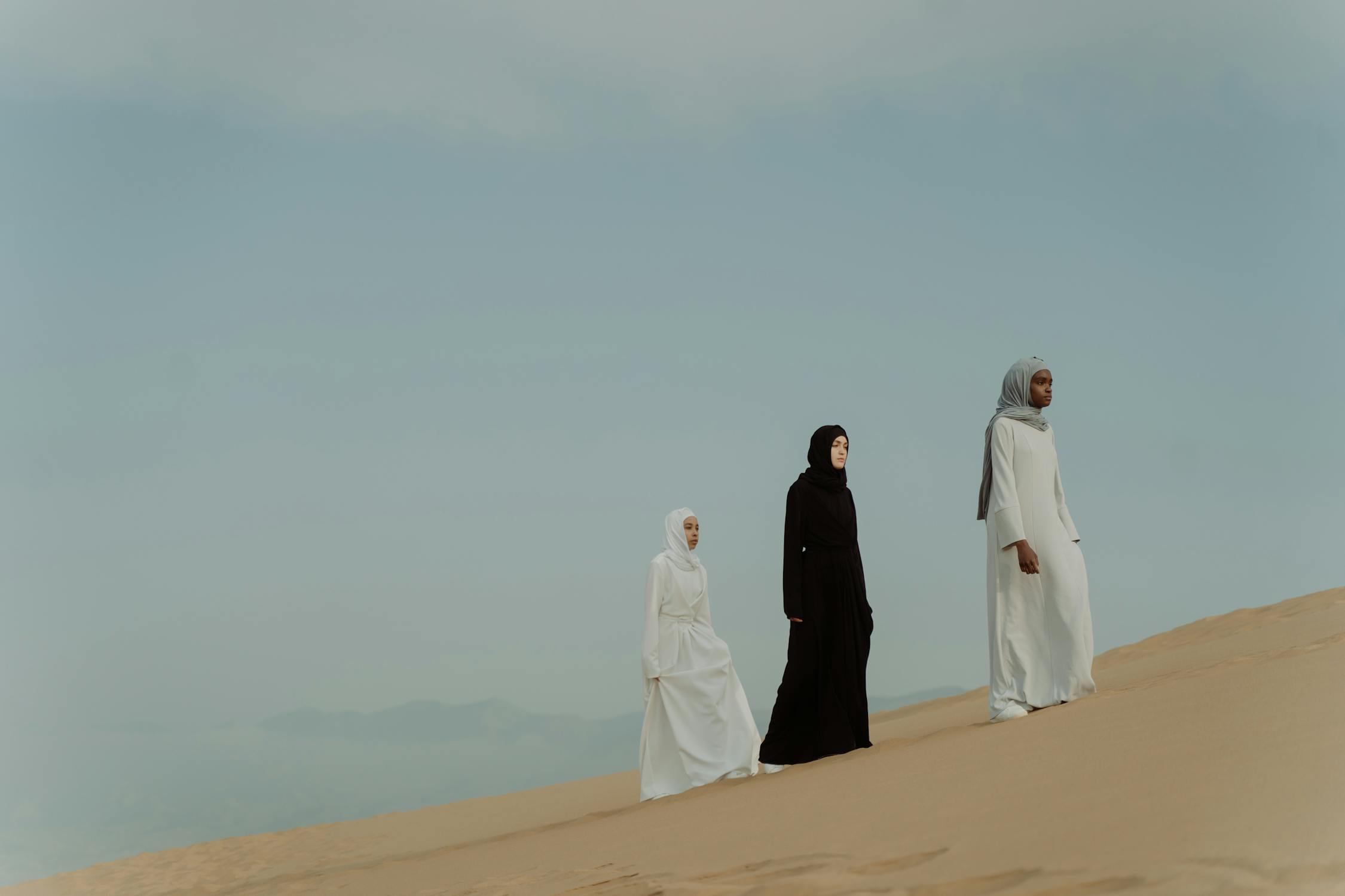Women in Hijab Walking in the Desert · Free Stock Photo