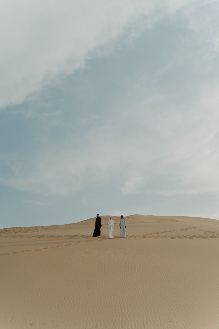 Women Walking In The Desert