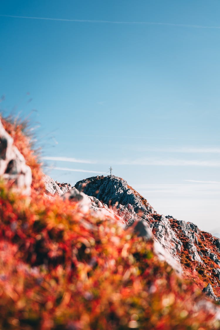 Cross On Mountain Peak In Autumn