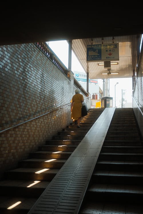 Woman Walking Up the Stairs