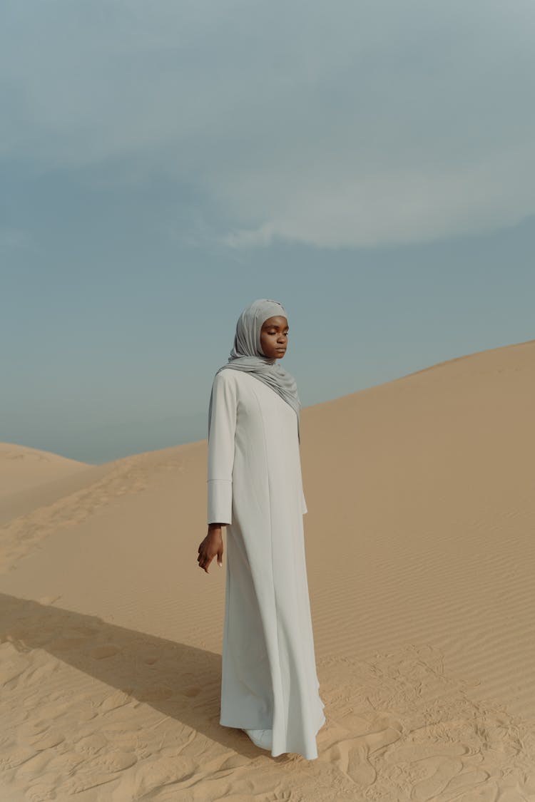 A Woman Standing On The Desert