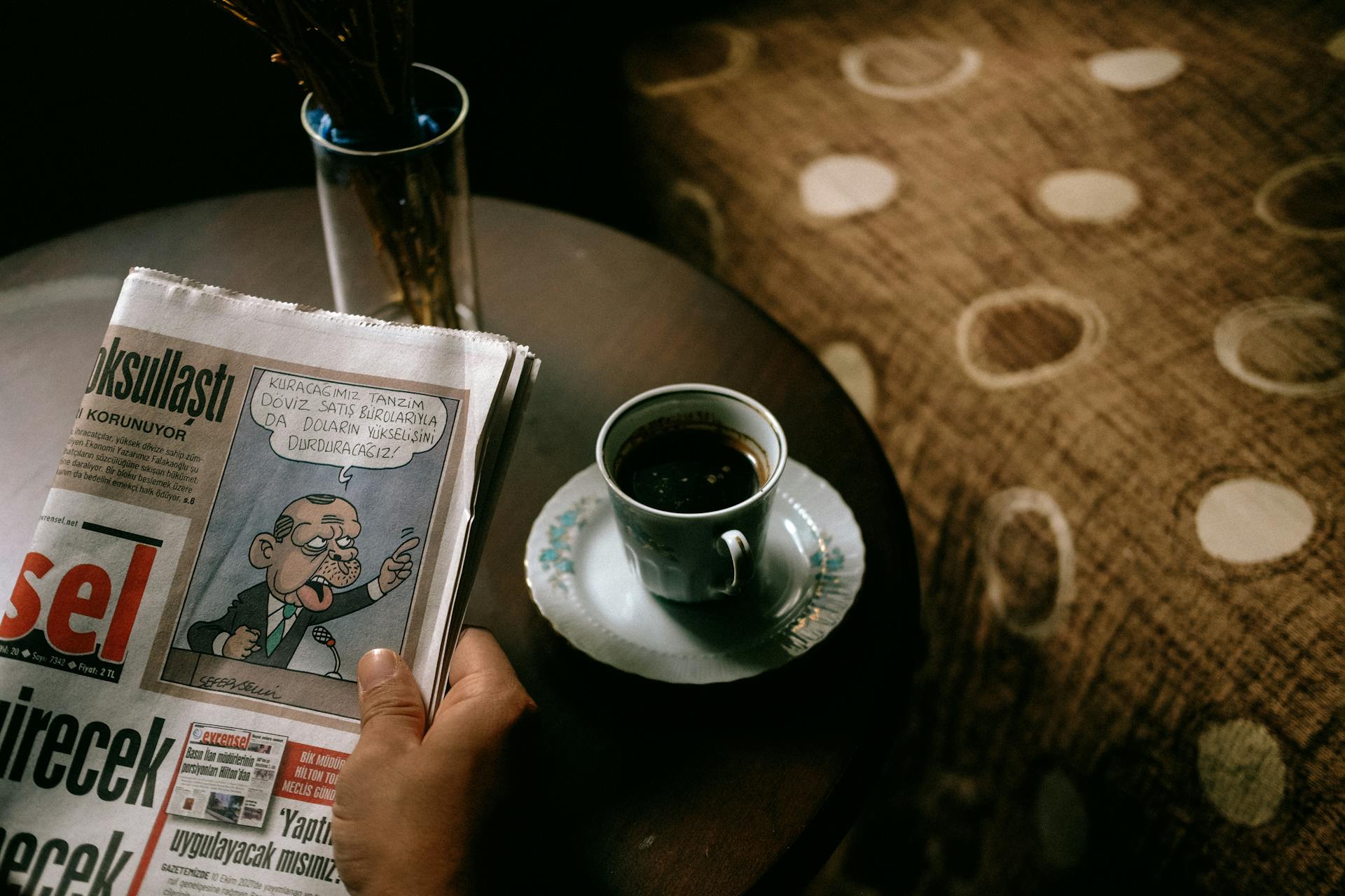 A Person Holding a Newspaper