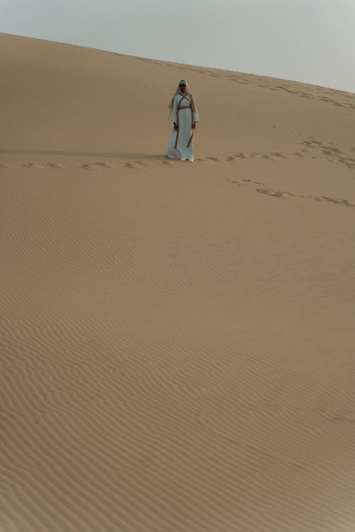 Free A Person Walking at the Desert Stock Photo