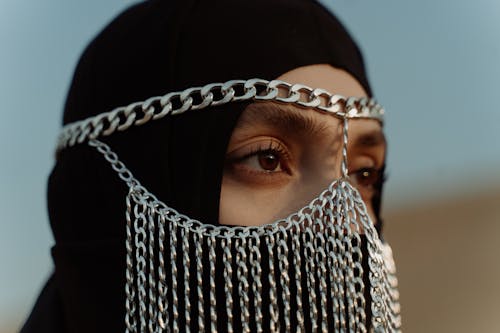 Close Up Shot of a Woman Wearing Hijab and Jewelry