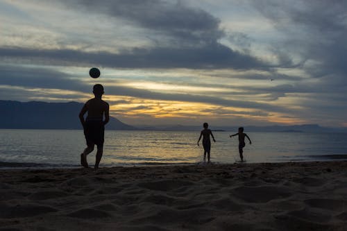 Silhouette of Boys at the Beach