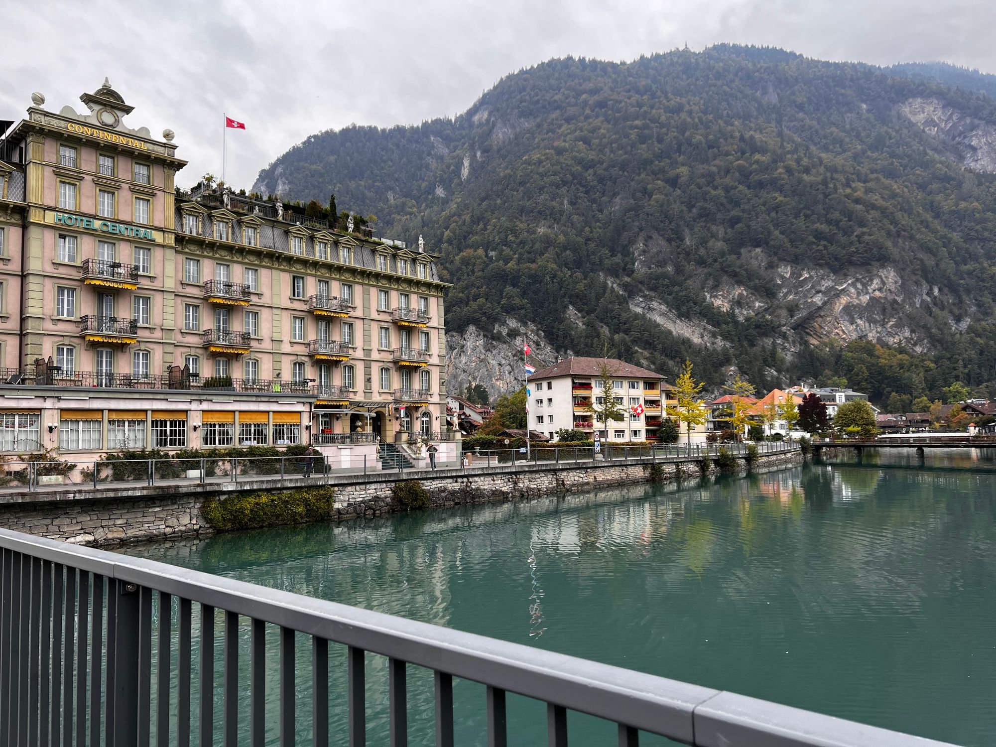 Charming hotel by a mountain river with scenic views and serene ambiance.
