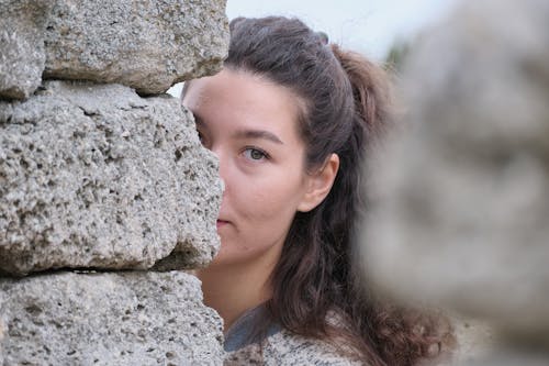 Free A Woman Behind a Wall Stock Photo