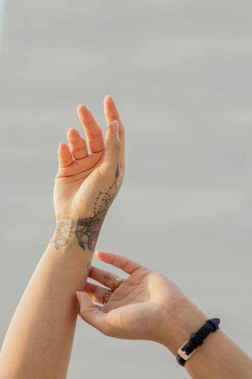 Free Womans Hands Raised to Sky Stock Photo