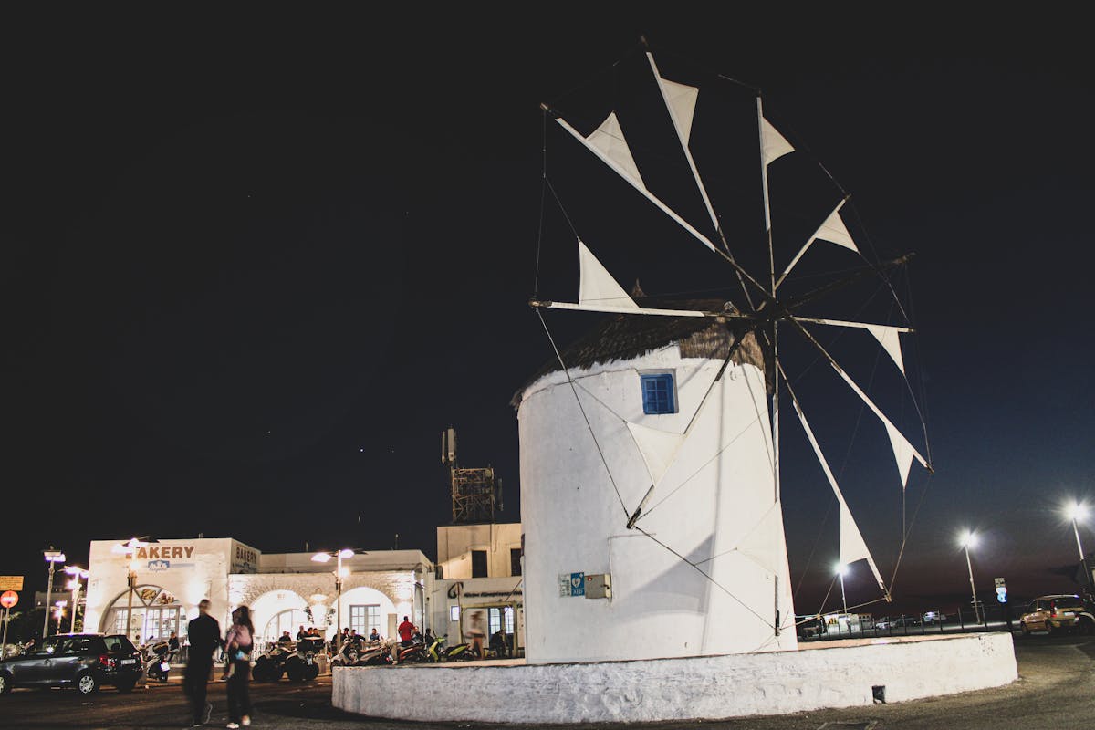Flatlay of fashion accessories such as belts, bags, sunglasses, and jewelry on a neutral surface