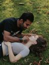 Couple Laying on Grass
