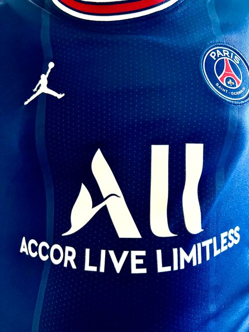 Free Detailed view of Paris Saint-Germain jersey with sponsor logos and design elements. Stock Photo