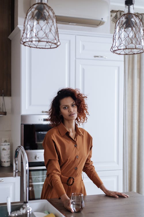 Woman Standing by Table