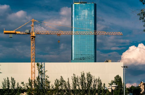 Free stock photo of blue sky, crane tower, tall building Stock Photo