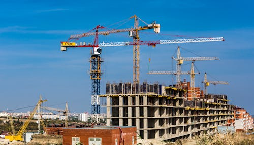 Free stock photo of blue sky, cloudless sky, tower cranes Stock Photo