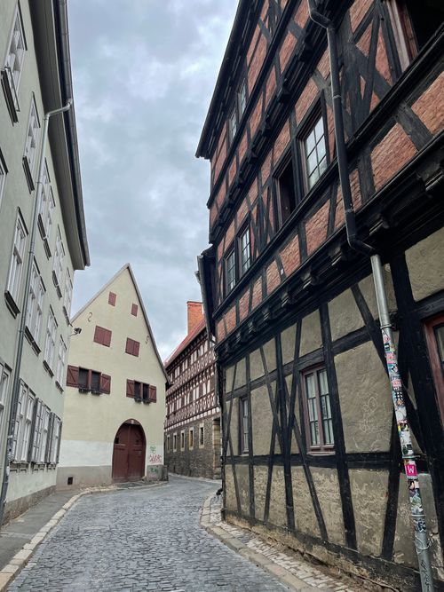 Free Discover the half-timbered architecture of Erfurt's charming paved street in Germany. Stock Photo